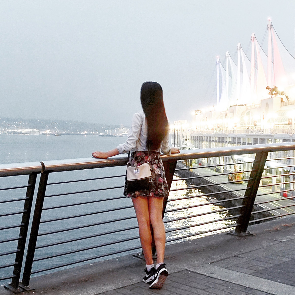 girl-looking-out-at-port-of-vancouver